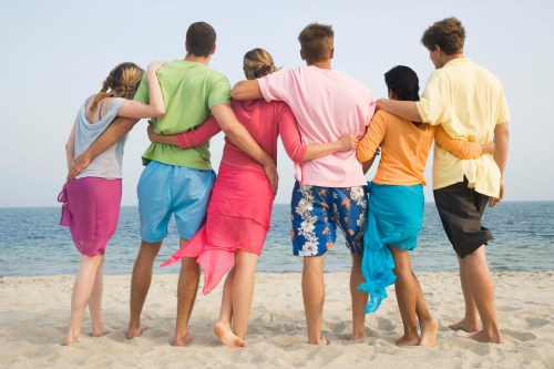 Summer - Friends on beach looking at ocean